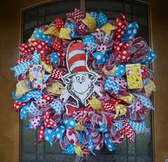 the cat in the hat wreath is hanging on the front door