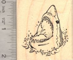 a rubber stamp with a drawing of a shark