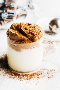 a glass mug filled with some kind of dessert