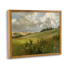 a painting on the wall of a green field with clouds in the sky above it