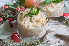 two small cups filled with oatmeal and garnished with mint