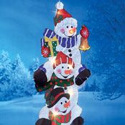 an inflatable snowman and two snowmen on top of each other with christmas lights