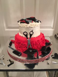 a cake that has scissors on top of it