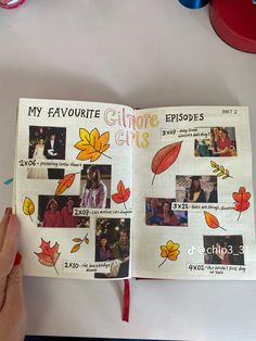 an open book with pictures of people and leaves on the pages is held up by a person's hand