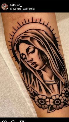 a woman's tattoo on the arm with sun rays coming out of her head