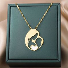 Celebrate the unbreakable bond between mother and child with our "Mother's Embrace" Heart Pendant Necklace. Crafted from durable stainless steel, this necklace features a poignant silhouette of a mother and her child within a heart, symbolizing love and connection. This piece is designed not just as a beautiful accessory but as a celebration of motherhood's nurturing spirit. Perfect for Mother's Day, as a gift for new mothers, or as a token of appreciation, this necklace is a daily reminder of l Adjustable Stainless Steel Necklace For Mother's Day, Mother's Day Heart Pendant Necklace In Stainless Steel, Stainless Steel Heart Pendant Necklace For Mother's Day, Mother's Day Stainless Steel Heart Pendant Necklace, Mother's Day Stainless Steel Necklace For Mom, Mother's Day Gift Stainless Steel Necklace, Personalized Stainless Steel Heart Necklace For Mother's Day, White Stainless Steel Necklaces For Mother's Day, Mother's Day White Stainless Steel Necklaces