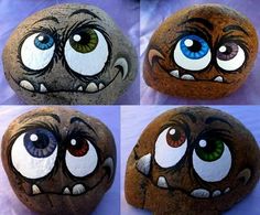 four pictures of different eyes painted on rocks