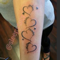 a woman with a tattoo on her arm that says, love is in the air