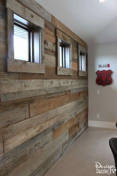 an empty room with wood paneling on the wall