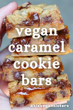 vegan caramel cookie bars stacked on top of each other in front of the camera