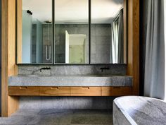 a bathroom with a sink, mirror and bathtub