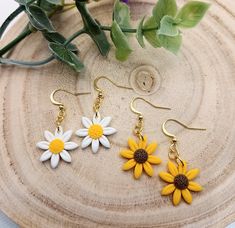 SUNFLOWER / DAISY Elegant and Beautiful 18k Gold Plated Drop Earrings featuring a relief flower design. Gift pouch included Earring including hook measures approx 4.3cm in length. Handmade in Hampshire, UK Polymer clay is lightweight, making it comfortable to wear as earrings. This is especially important for larger or statement earrings where weight can become an issue with other materials. These earrings are hand crafted by myself so there may be slight variations compared to the picture.  Eac Yellow Jewelry With 3d Flower Details, Sunflower Daisy, Hampshire England, Hampshire Uk, Gift Flower, Jewellery Gift, Gift Pouch, Flower Gift, Flower Design