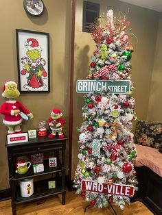 a christmas tree decorated with street signs and ornaments