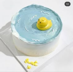 a yellow rubber duck floating in the water