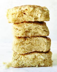 three pieces of biscuit stacked on top of each other in front of a white background