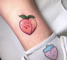 an apple with a hand print on the inside of it's arm and foot