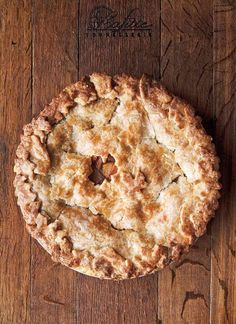 a pie sitting on top of a wooden table