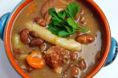 a close up of a bowl of food with beans