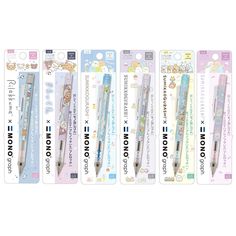 four different types of pens with hello kitty characters on them, all lined up in a row