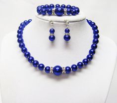 "14\" Dark Blue Lapis Glass Pearl Necklace/Bracelet/Earrings Set for Little Girl  These necklaces sets are made with 8/12mm dark blue lapis glass pearls, 6/8mm crystal Rondelle rhinestone beads, crystal silver lined seed beads and accented with an 12mm dark blue lapis glass pearl between rhinestones at the center. It is 14\" in length and fastens silver plated lobster clasp. It comes with bracelet and earrings that hang from 4mm silver plated butterfly ear posts. It makes a great and inexpensive