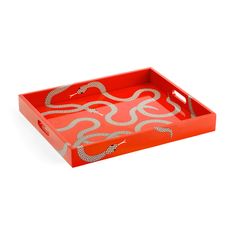 a red tray with a snake design on it