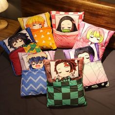 six pillows with anime characters on them are arranged in a square pattern, and each has an individual's own pillow