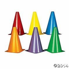 a group of colorful cones sitting next to each other on top of a white surface