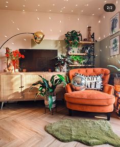 a living room filled with furniture and plants