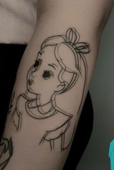 a woman's arm with a drawing of a girl on it