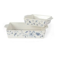 two white dishes with blue flowers on them