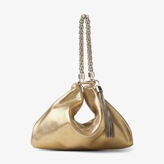 In futuristic, shimmery gold metallic leather, our CALLIE clutch bag is arm candy at its finest. It’s the ideal accent to sleek eveningwear, and comes in a chic compact shape, with a jewel-style chain strap and tassel trim that perfectly complements the hue. Carry this versatile style by looping the chain through the hoop to create a handheld evening pouch; alternatively, wear the chain draped effortlessly over your arm. Evening Accessories, Fall Handbags, Suede Clutch, Designer Clutch, Liquid Gold, Leather Clutch Bags, Pink Suede, Metallic Leather, Leather Clutch