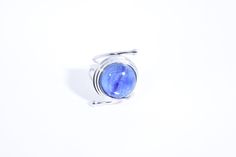 great color Deep blue Kyanite stone surrounded by a cool modern setting The setting is handcrafted in Sterling silver Size 7.5 Can be sized All rings are shipped in a nice gift box. Check out our over a THOUSAND great reviews Engraving is $4 per letter and is not always perfect depending on the piece. It can take a few days if the jeweler is busy. This is payable to Paypal Judithsltd@gmail.com Modern Cabochon Sapphire Ring For Gift, Modern Sterling Silver Blue Ring, Modern Blue Sterling Silver Ring, Blue Amethyst Gemstone Ring, Blue Tanzanite Rings For Gift, Blue Ethical Moonstone Ring For Gift, Blue Amethyst Gemstone Ring Gift, Handmade Blue Jewelry With Round Stone, Modern Handmade Moonstone Ring For Gift