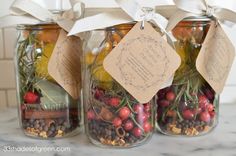 three jars filled with different types of food