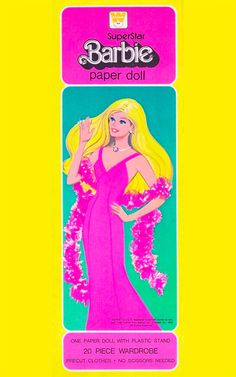 barbie paper doll in pink dress with pom poms around her neck and chest