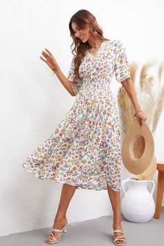 Summer V-neck Dress With Ditsy Floral Print, Spring Vacation A-line Floral Dress, V-neck Floral Dress With Ditsy Print, V-neck Midi Dress With Ditsy Floral Print For Summer, Flowy V-neck Dress With Short Sleeves For Spring, Floral Print Sundress V-neck For Day Out, Fitted Floral Print V-neck Dress For Spring, Feminine Fitted Floral Print V-neck Dress, Spring V-neck Dress With Short Sleeves For Day Out