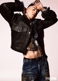 a shirtless man in black leather jacket and jeans posing for a magazine cover photo