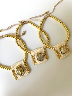 Experience the luxurious elegance of our gold-plated adjustable scapular cream bracelet. Enhance your style and look effortlessly chic with this beautiful accessory. Gift Card Sale, Fine Jewellery Earrings, Clothes Gift, Men's Collection, Ring Bracelet, Earring Necklace, Necklaces Bracelets, Your Style, Rings For Men