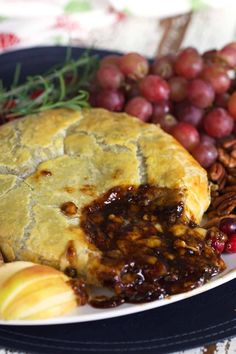 a close up of a plate of food with grapes