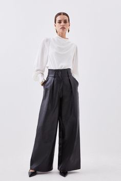 {@@=Ist.Core.Helpers.StringHelper.ToProperCase("An elevated take on classic tailored pants, this piece can be styled from fall to winter with ease. A high waisted design cinches the waist with sumptuous faux leather that falls to the floor for a long length contemporary style, while a wide leg style adds unmatched comfort. Pair with a simplistic blouse for a sleek ensemble from workwear to smart occasions.Expertly designed for those 5'3" and under, our Petite pieces are perfectly proportioned fo