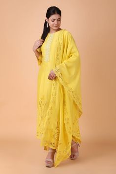 Yellow straight kurta with placement floral cutwork pattern. Paired with a pant and dupatta with floral cutwork pattern. - Aza Fashions Festive Semi-stitched Cutwork Kurta, Slub Silk Palazzo Set With Chikankari Embroidery, Georgette Salwar Kameez With Chikankari Embroidery, Festive Straight Kurta With Cutwork, Straight Kurta With Cutwork For Navratri, Cutwork Straight Kurta For Navratri, Straight Cutwork Kurta For Navratri, Eid Kurta With Cutwork In Mulmul, Eid Cutwork Straight Kurta