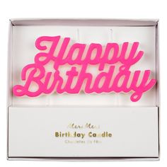 a birthday candle in a box with the words happy birthday on it