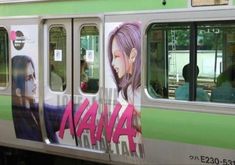 a subway car with graffiti on the side and people sitting in the passenger cars behind it