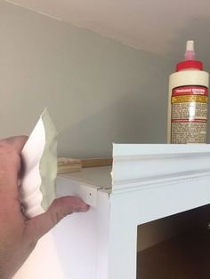 Upgrade builder grade kitchen cabinets and learn how to Install Kitchen Cabinet Crown Moulding. Make over boring cabinet doors by adding trim with this easy cabinet moulding hack. #kitchencabinet #crownmoulding #diy Craft Storage Cabinet, Simple Crown Molding, Rolling Pantry, Diy Concrete Counter, Simple Crown, Top Of Kitchen Cabinets