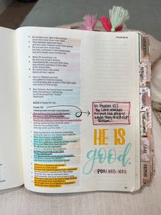 an open bible with the words he is god on it