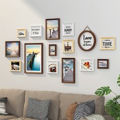 a living room filled with furniture and framed pictures on the wall above it's sofa