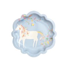 a paper plate with a white horse painted on it's side and floral designs