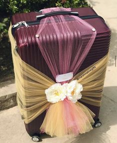 Burgundy suitcase wrapped with gold and burgundy net for engagement dowry wrapping. Net Packing Hamper, Bridal Suitcase Packing