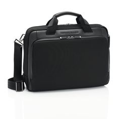 a black briefcase sitting on top of a white floor