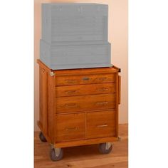 a wooden cart with two large storage boxes on it's top and bottom shelf