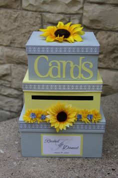 two boxes with sunflowers on them and the words cards are written in yellow